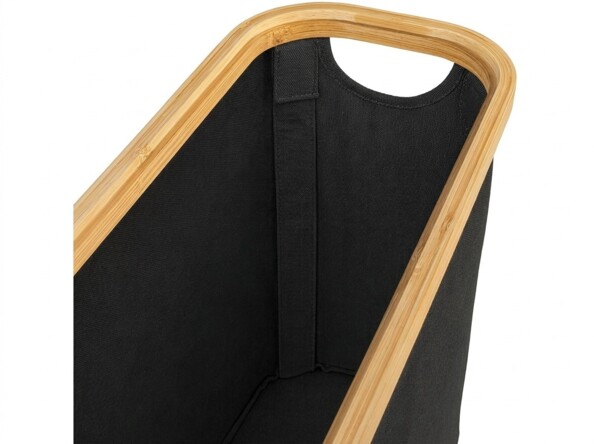 Intérieur noir du panier bordé de bambou avec poignée découpée et couture de renfort