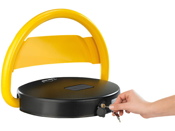 Verrouillage de l'arceau de parking jaune et noir par clé