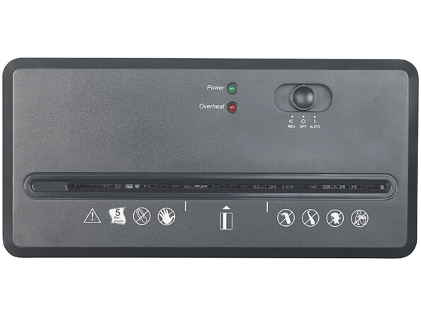 Couvercle du destructeur de documents avec fente pour entrée de papier, bande avec symboles d'avertissement relatifs à l'utilisation de l'appareil, commutateur de mode de fonctionnement (Marche/Arrêt/Marche arrière) et deux voyants de statut