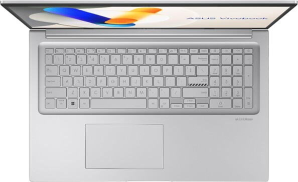 Vue du dessus de l'ordinateur portable ouvert sur écran d'accueil avec clavier AZERTY, pavé tactile et pavé numérique