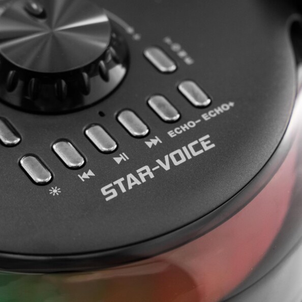 Vue du dessus de l'enceinte karaoké Star Voice avec LED d'ambiance rouge, boutons de commande argentés et molette de réglage FM noir brillant