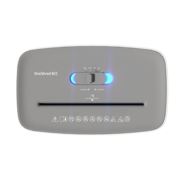 Tête de broyage vue du dessus avec orifice d'entrée du papier, sélecteur de mode et logos d'avertissement imprimés en blanc