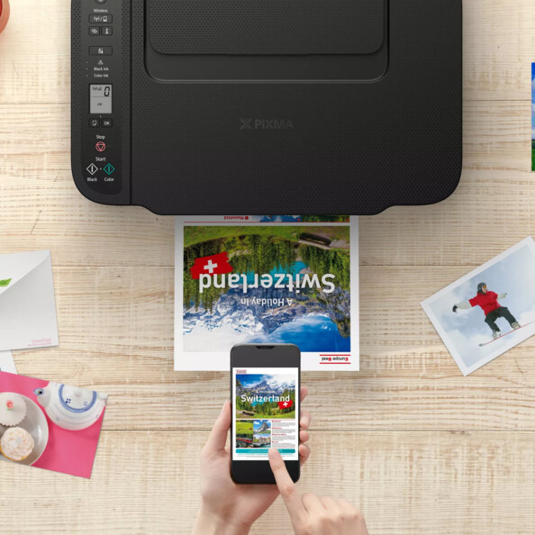 Impression en cours d'une brochure de tourisme en Suisse via application mobile