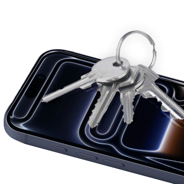 Mise en situation de la vitre de protection en verre trempé sur un iPhone 17 Pro Max allumé protégeant l'écran contre les rayures de clés