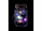 Lanterne solaire LED motif fée allumée dans la nuit sur fond noir
