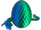 dragon imprimé en 3D articulé posé à coté de son oeuf