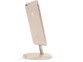 iPhone coloris or sur pied de support rond de la même couleur