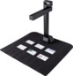 Scanner IRIScan Desk noir avec tapis et six cartes de visite dispersées à numériser