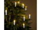 Des bougies LED XMS-35.r accrochées dans un sapin de Noël.