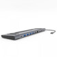 Hub USB-C multiports gris avec quatre USB-A bleus, RJ45, HDMI et fente de ventilation