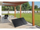 Panneau solaire compatible utilisation marine posé sur une terrasse en bois sous une pergola en bois en extérieur dans un jardin face au soleil