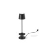 Lampe avec abat-jour sans fil coloris noir mal en lévitation au-dessus de sa base chargement filaire secteur