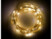 Guirlande LED décorative en fil de cuivre enroulée sur elle-même et allumée dans le noir